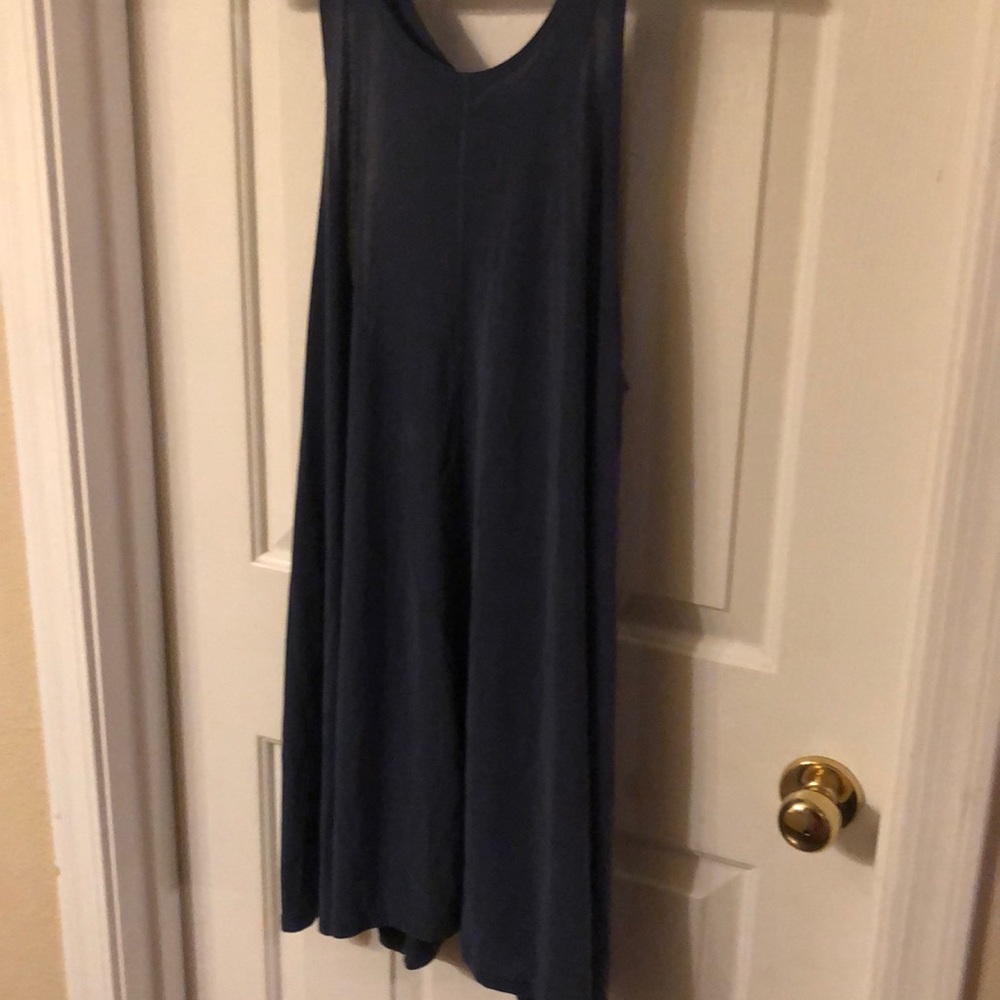 A light , airy , blue sleeveless dress